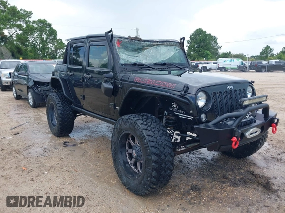 2015 Jeep Wrangler Unlimited Rubicon Hard Rock with VIN 1C4HJWFG0FL674700, listed as a IAAI auction lot 42511949 with 138,370 mi miles and . Bid and sale history available at DreamBid. Image 1.