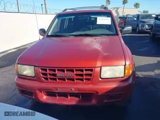 1999 Isuzu Rodeo S with VIN 4S2CK58W3X4307201, listed as a IAAI auction lot 41884901 with 236,970 mi miles. Bid and sale history available at carsss.com. Image 6.