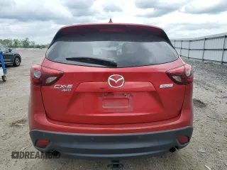 2016 Mazda CX-5 Grand Touring with VIN JM3KE4DY0G0664379, listed as a Copart auction lot 54659005 with 116,022 mi miles and Salvage Title. Bid and sale history available at DreamBid. Image 6.