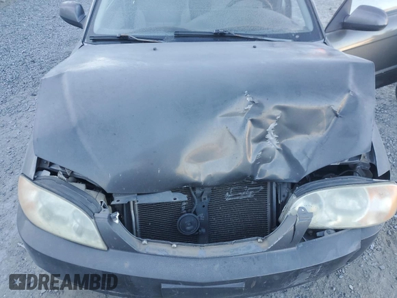 2003 Kia Spectra with VIN KNAFB121235248271, listed as a Copart auction lot 82426614 with 151,347 mi miles and Salvage Title. Bid and sale history available at DreamBid. Image 11.
