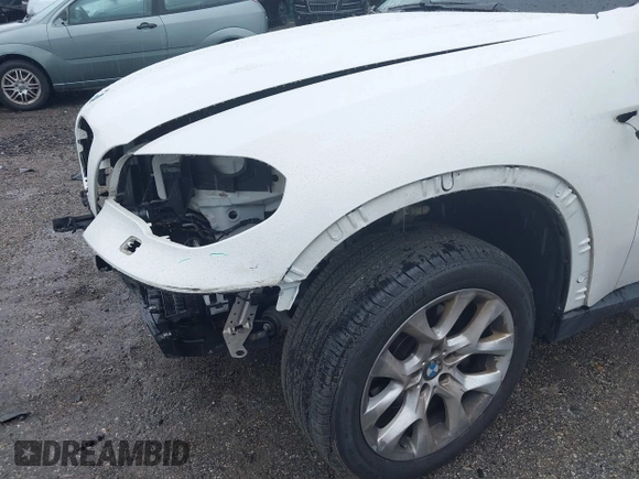 2013 BMW X5 xDrive35i z VIN 5UXZV4C53D0E14968, wystawiony jako IAAI lot #42253469 z przebiegiem 53 562 mil mil oraz . Historia ofert i sprzedaży dostępna na DreamBid. Obrazek 22.
