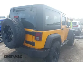 2012 Jeep Wrangler Sport with VIN 1C4AJWAG0CL128595, listed as a IAAI auction lot 42048590 with 133,085 mi miles and . Bid and sale history available at DreamBid. Image 4.