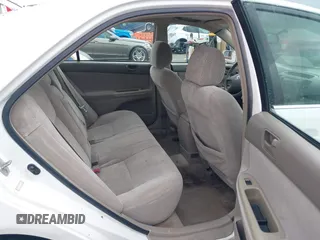 2002 Toyota Camry LE z VIN 4T1BE32K52U081479, wystawiony jako IAAI lot #41344104 z przebiegiem 243 950 mil mil oraz . Historia ofert i sprzedaży dostępna na DreamBid. Obrazek 8.