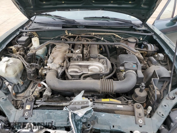 2001 Mazda MX-5 Miata z VIN JM1NB353810212392, wystawiony jako Copart lot #44398295 z przebiegiem 88 601 mil mil oraz Szkoda całkowita • Salvage title. Historia ofert i sprzedaży dostępna na DreamBid. Obrazek 13.