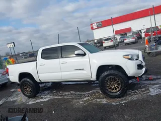 2019 Toyota Tacoma SR z VIN 3TMCZ5AN9KM284092, wystawiony jako IAAI lot #41774851 z przebiegiem 100 031 mil mil oraz . Historia ofert i sprzedaży dostępna na DreamBid. Obrazek 13.