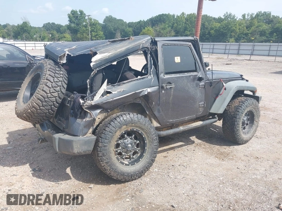 2014 Jeep Wrangler Sport with VIN 1C4AJWAGXEL233647, listed as a IAAI auction lot 39993785 with Not Provided miles and . Bid and sale history available at DreamBid. Image 4.
