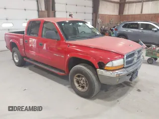 2000 Dodge Dakota Sport z VIN 1B7GG2AN7YS721013, wystawiony jako IAAI lot #42762045 z przebiegiem 168 754 mil mil oraz . Historia ofert i sprzedaży dostępna na DreamBid. Obrazek 1.