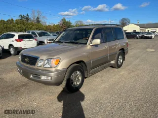 2001 Lexus LX 470 with VIN JTJHT00W013503765, listed as a Copart auction lot 80843654 with 219,615 mi miles and Clean Title. Bid and sale history available at carsss.com. Image 1.