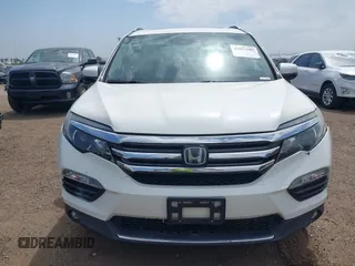2017 Honda Pilot Touring with VIN 5FNYF5H95HB042632, listed as a IAAI auction lot 42011885 with 103,321 mi miles. Bid and sale history available at carsss.com. Image 13.