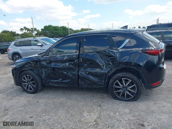 2018 Mazda CX-5 Grand Touring with VIN JM3KFBDM2J0390611, listed as a IAAI auction lot 42006482 with 97,497 mi miles. Bid and sale history available at carsss.com. Image 14.