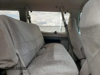 1992 Ford Econoline Wagon Super Custom z VIN 1FBJS31H3NHB08839, wystawiony jako Copart lot #55049275 z przebiegiem 158 054 mil mil oraz Szkody całkowita. Historia ofert i sprzedaży dostępna na DreamBid. Obrazek 11.
