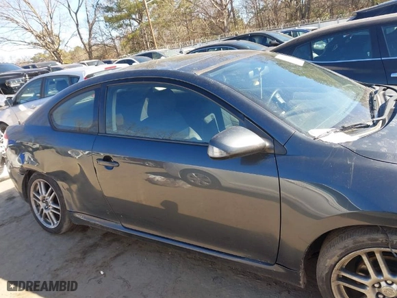 2005 Scion tC with VIN JTKDE177950016483, listed as a IAAI auction lot 41419579 with 370,000 mi miles. Bid and sale history available at carsss.com. Image 13.