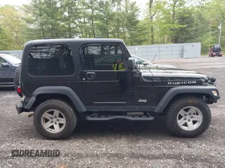 2006 Jeep Wrangler Rubicon z VIN 1J4FA69S76P749712, wystawiony jako IAAI lot #42240375 z przebiegiem 75 405 mil mil oraz . Historia ofert i sprzedaży dostępna na DreamBid. Obrazek 13.