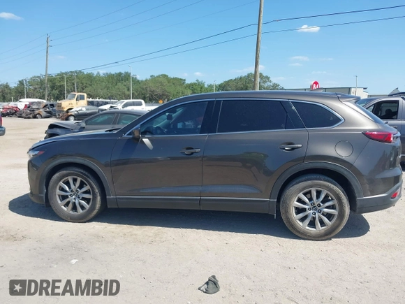 2019 Mazda CX-9 Touring with VIN JM3TCACY9K0304899, listed as a IAAI auction lot 42167180 with 57,043 mi miles and . Bid and sale history available at DreamBid. Image 14.