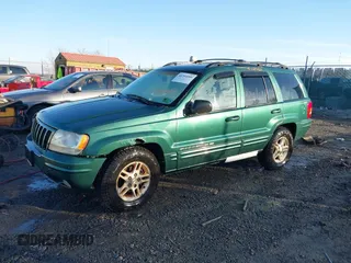 1999 Jeep Grand Cherokee Limited with VIN 1J4GW68S1XC555399, listed as a IAAI auction lot 41764099 with 1 mi miles. Bid and sale history available at carsss.com. Image 2.