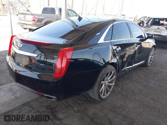 2013 Cadillac XTS Luxury with VIN 2G61P5S35D9105460, listed as a IAAI auction lot 42582313 with 144,895 mi miles and . Bid and sale history available at DreamBid. Image 4.
