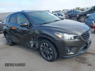 2016 Mazda CX-5 Grand Touring z VIN JM3KE4DY2G0684066, wystawiony jako IAAI lot #42078725 z przebiegiem 200 129 mil mil oraz . Historia ofert i sprzedaży dostępna na DreamBid. Obrazek 1.