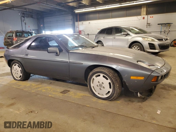 1984 Porsche 928 z VIN WP0JB0925ES861303, wystawiony jako Copart lot #41979575 z przebiegiem 114 593 mil mil oraz Nie do naprawy • Non repairable. Historia ofert i sprzedaży dostępna na DreamBid. Obrazek 4.