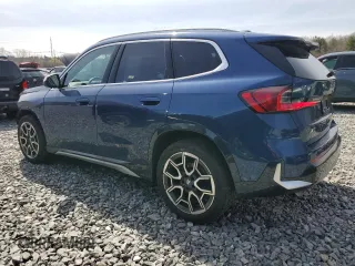 2023 BMW X1 xDrive28i with VIN WBX73EF05P5Y21721, listed as a Copart auction lot 50749295 with 10,633 mi miles and Salvage title. Bid and sale history available at DreamBid. Image 2.