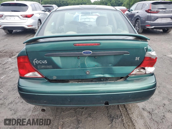 2000 Ford Focus SE with VIN 1FAFP3433YW354797, listed as a Copart auction lot 61430265 with 165,202 mi miles and Salvage title. Bid and sale history available at DreamBid. Image 6.