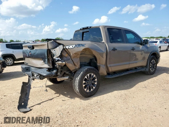 2021 Nissan Titan Pro-4X with VIN 1N6AA1EDXMN523826, listed as a Copart auction lot 61851765 with 85,783 mi miles and Salvage title. Bid and sale history available at DreamBid. Image 3.