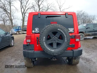2015 Jeep Wrangler Unlimited Sahara with VIN 1C4BJWEG3FL590491, listed as a IAAI auction lot 41642219 with 148,759 mi miles. Bid and sale history available at carsss.com. Image 15.