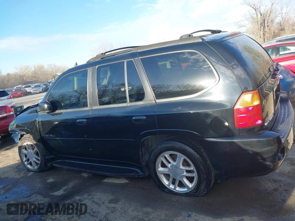 2006 GMC Envoy Denali with VIN 1GKET63M962355586, listed as a IAAI auction lot 41881023 with 235,506 mi miles. Bid and sale history available at carsss.com. Image 14.