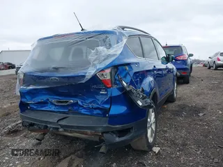2017 Ford Escape SE with VIN 1FMCU9GD9HUE11122, listed as a IAAI auction lot 39049615 with 130,865 mi miles and . Bid and sale history available at DreamBid. Image 4.