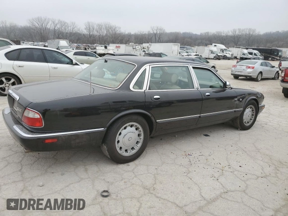 1999 Jaguar XJ z VIN SAJKD6043XC872105, wystawiony jako Copart lot #86270724 z przebiegiem Nie podano mil oraz Szkoda całkowita • Salvage title. Historia ofert i sprzedaży dostępna na DreamBid. Obrazek 3.