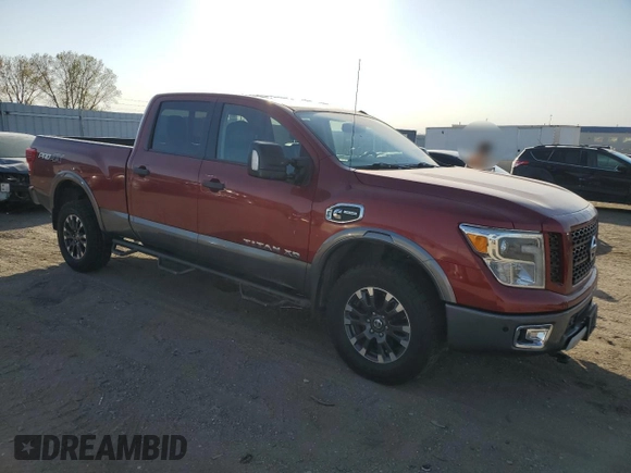 2016 Nissan Titan XD PRO-4X with VIN 1N6BA1F43GN512559, listed as a Copart auction lot 82991154 with 0 mi miles and Salvage Title. Bid and sale history available at carsss.com. Image 4.