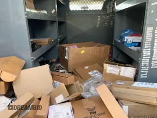 2019 Chevrolet Express Cargo Van with VIN 1GCWGAFG2K1328307, listed as a IAAI auction lot 42059558 with 103,177 mi miles. Bid and sale history available at carsss.com. Image 1.