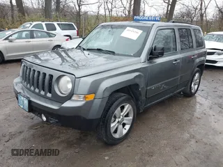 2013 Jeep Patriot Latitude with VIN 1C4NJPFB8DD129848, listed as a IAAI auction lot 40949386 with 168,839 mi miles and . Bid and sale history available at carsss.com. Image 2.