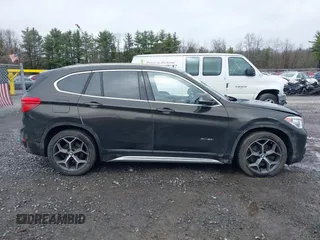 2018 BMW X1 xDrive28i with VIN WBXHT3C34J5K31430, listed as a IAAI auction lot 41954792 with 125,447 mi miles. Bid and sale history available at carsss.com. Image 13.