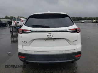 2021 Mazda CX-9 Touring z VIN JM3TCBCY1M0536616, wystawiony jako Copart lot #60242445 z przebiegiem 40 057 mil mil oraz Szkoda całkowita • Salvage title. Historia ofert i sprzedaży dostępna na DreamBid. Obrazek 6.