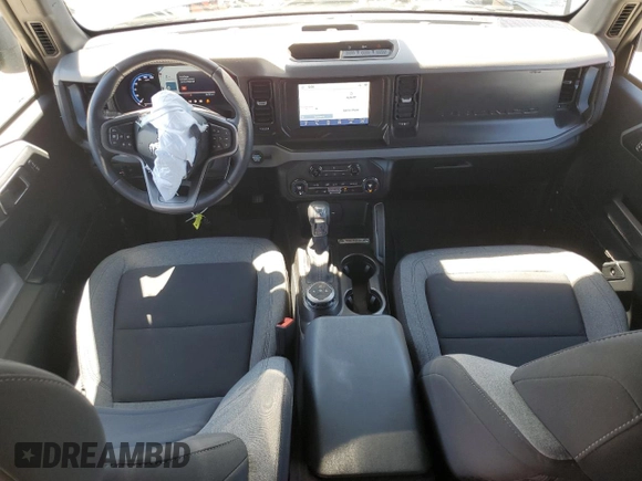 2023 Ford Bronco z VIN 1FMDE5BHXPLA99837, wystawiony jako Copart lot #56073885 z przebiegiem 9 679 mil mil oraz Szkoda całkowita • Salvage title. Historia ofert i sprzedaży dostępna na DreamBid. Obrazek 8.