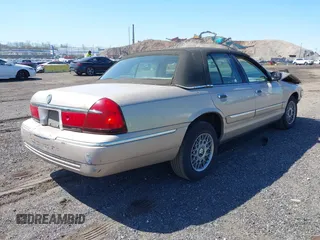 1998 Mercury Grand Marquis GS z VIN 2MEFM74W3WX668888, wystawiony jako IAAI lot #42042350 z przebiegiem 113 702 mil mil oraz . Historia ofert i sprzedaży dostępna na DreamBid. Obrazek 4.