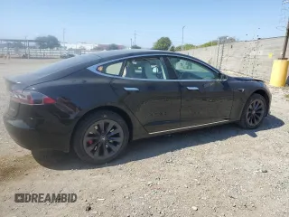 2019 Tesla Model S 100D with VIN 5YJSA1E42KF331240, listed as a Copart auction lot 54713975 with 43,940 mi miles and Salvage title. Bid and sale history available at DreamBid. Image 3.