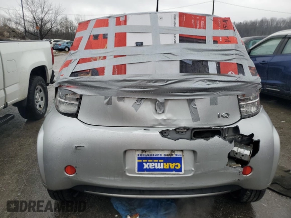 2013 Scion iQ with VIN JTNJJXB08DJ025554, listed as a Copart auction lot 88923885 with 110,378 mi miles and Salvage title. Bid and sale history available at DreamBid. Image 6.