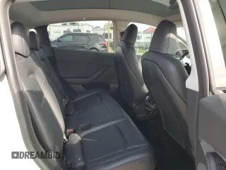 2023 Tesla Model Y Long Range z VIN 7SAYGDEE2PA065048, wystawiony jako Copart lot #48403655 z przebiegiem 56 553 mil mil oraz Szkoda całkowita • Salvage title. Historia ofert i sprzedaży dostępna na DreamBid. Obrazek 10.