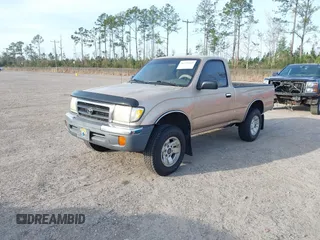 1999 Toyota Tacoma with VIN 4TAPM62NXXZ439318, listed as a IAAI auction lot 41721442 with 299,876 mi miles and . Bid and sale history available at DreamBid. Image 2.