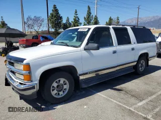 1999 Chevrolet Suburban with VIN 3GNEC16R0XG164600, listed as a Copart auction lot 49516445 with 105,747 mi miles and Salvage Title. Bid and sale history available at carsss.com. Image 1.