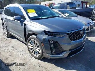 2020 Cadillac XT6 FWD Premium Luxury with VIN 1GYKPCRS3LZ137194, listed as a IAAI auction lot 41569297 with 61,966 mi miles. Bid and sale history available at carsss.com. Image 1.