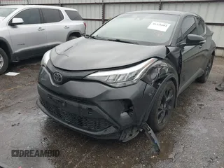 2021 Toyota C-HR LE with VIN JTNKHMBX0M1129080, listed as a IAAI auction lot 41321604 with 52,916 mi miles. Bid and sale history available at carsss.com. Image 2.