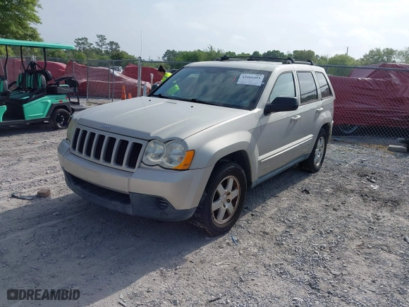 2010 Jeep Grand Cherokee Laredo with VIN 1J4PS4GK6AC136702, listed as a IAAI auction lot 42066484 with 126,509 mi miles. Bid and sale history available at carsss.com. Image 2.