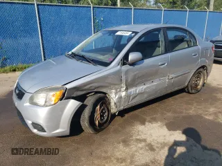 2011 Kia Rio with VIN KNADH4B32B6915275, listed as a Copart auction lot 71546484 with 297,998 mi miles and Salvage Title. Bid and sale history available at DreamBid. Image 1.