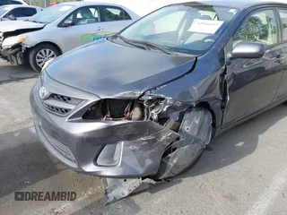 2011 Toyota Corolla L with VIN JTDBU4EE7B9162022, listed as a IAAI auction lot 42066643 with 124,384 mi miles. Bid and sale history available at carsss.com. Image 6.