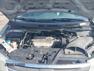 2012 Honda Odyssey EX-L with VIN 5FNRL5H65CB039015, listed as a IAAI auction lot 42612886 with 216,955 mi miles and . Bid and sale history available at DreamBid. Image 10.