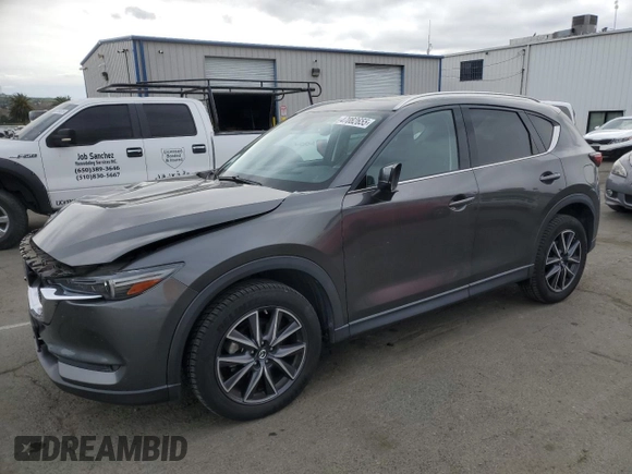 2018 Mazda CX-5 S Premium with VIN JM3KFBDM1J1352233, listed as a Copart auction lot 47082655 with 70,350 mi miles and Salvage Title. Bid and sale history available at DreamBid. Image 1.