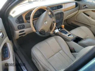 2003 Jaguar S-Type z VIN SAJEA01U73HM48330, wystawiony jako Copart lot #80128574 z przebiegiem Nie podano mil oraz Szkody całkowita. Historia ofert i sprzedaży dostępna na DreamBid. Obrazek 8.