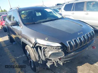 2014 Jeep Cherokee Trailhawk with VIN 1C4PJMBS6EW167517, listed as a IAAI auction lot 41947552 with 233,572 mi miles. Bid and sale history available at carsss.com. Image 1.